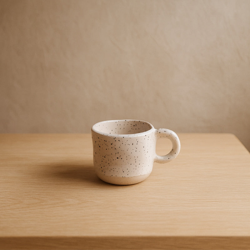 japanese tea cup ceramic on a table in a wabi sabi room.