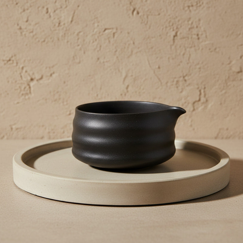 Matcha cup ceramic on a beige tray with a beige background