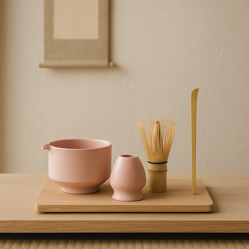matcha making set with​ tools on a wooden surface with a neutral background