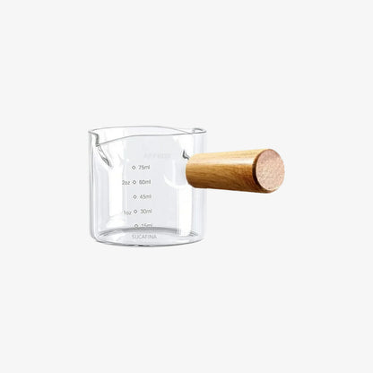 measuring cup coffee glass​ with wooden handle on a white background
