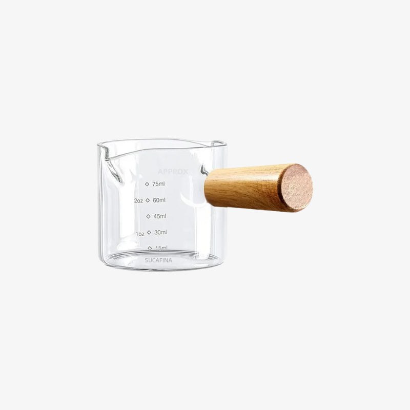 measuring cup coffee glass​ with wooden handle on a white background
