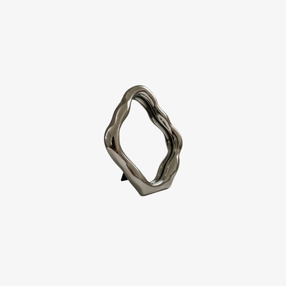 mini mirror​ with a wavy design on a white background