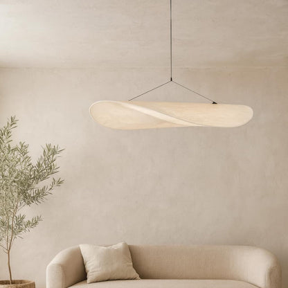 Modern ceiling led lights​ hanging above a beige sofa with a plant in the corner against a beige wall.