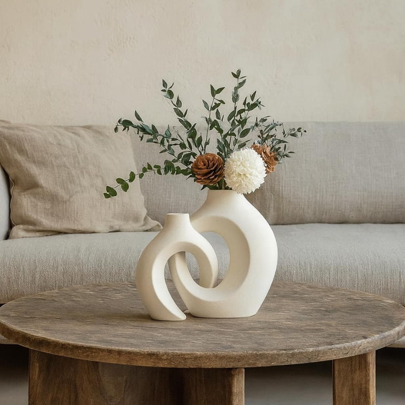 modern ceramic flower vases on a wabi sabi wooden table.