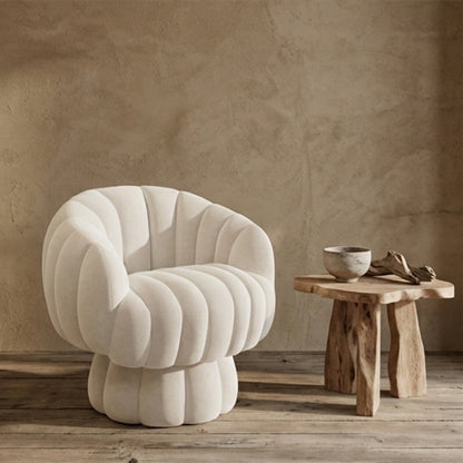 Modern chair lounge white in a room with a textured wall and wooden floor.