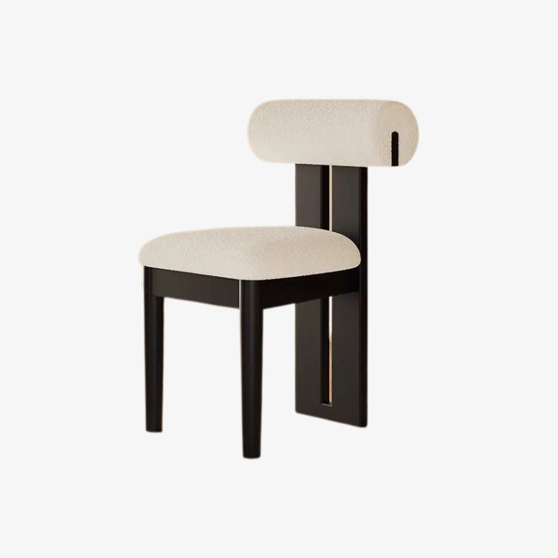 Modern minimalist dining chair​ with black frame and beige cushion on a white background