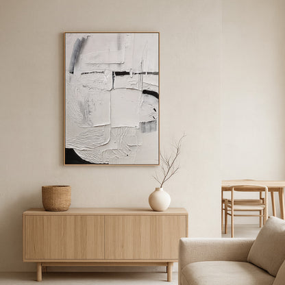 modern wall art for living room​ above a wooden console table with a vase.