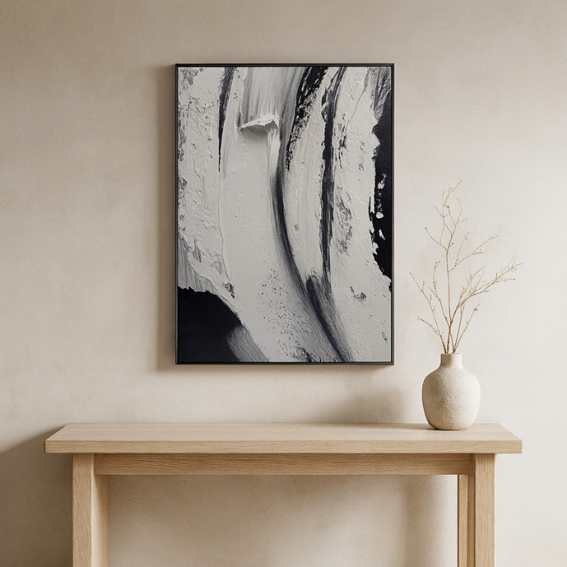 Abstract modern zen wall art​
painting on a beige wall above a wooden console table with a vase.