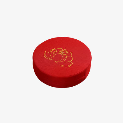 Red floor cushions​ with gold lotus design on a white background
