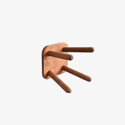 small wood stool​ with wooden legs on a white background