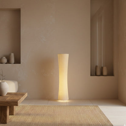 Standing rice paper lamp in a modern room with neutral colors