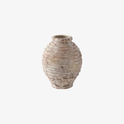 Textured ceramic vase on a white background