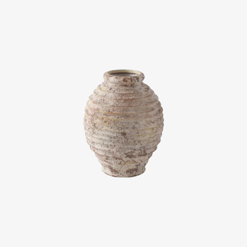 Textured ceramic vase on a white background