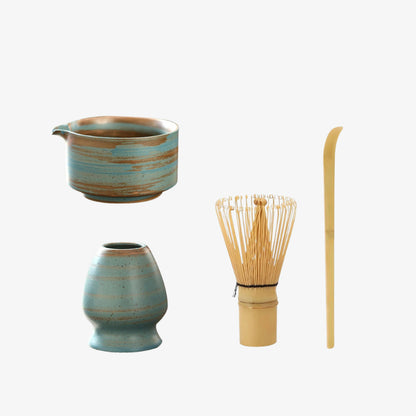 unique ceramic bowl designs​ with bamboo whisk and spoon on a white background