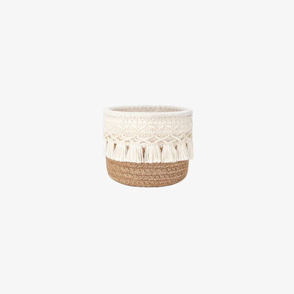 valentines make up basket​ with white crochet top and brown woven base on a white background