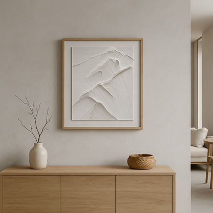 Framed abstract art in a wabi sabi art workshop​ with decorative items.