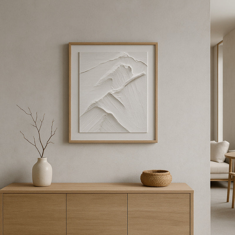 Framed abstract art in a wabi sabi art workshop​ with decorative items.