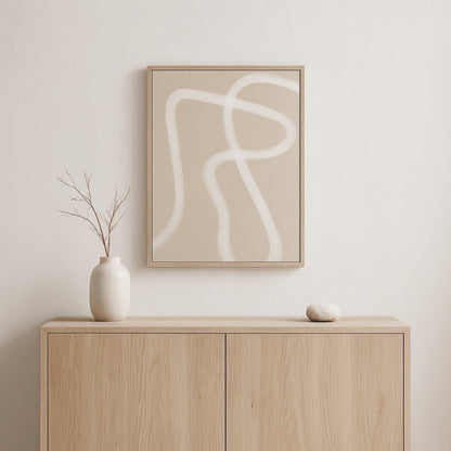 Beige wabi sabi canvas art on a wall above a wooden cabinet with decorative items.