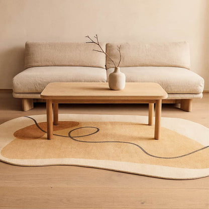 Beige sofa with a wooden coffee table and wabi sabi carpet in a minimalistic room.