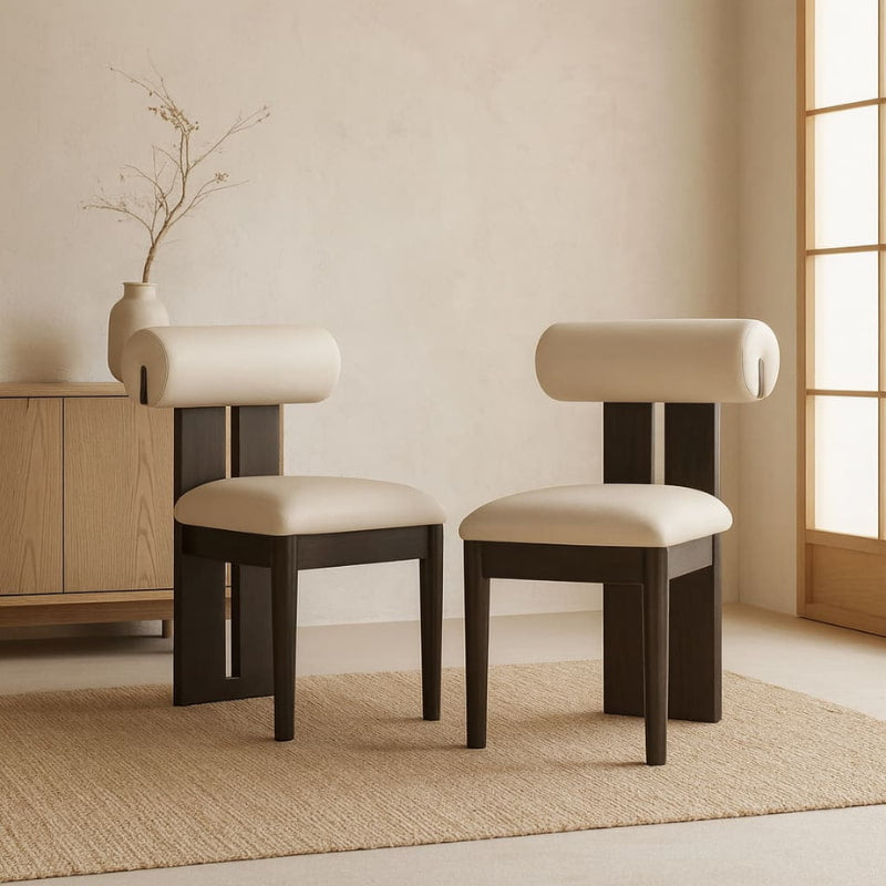 Two wabi sabi chair living room​ with beige cushions in a minimalistic room.