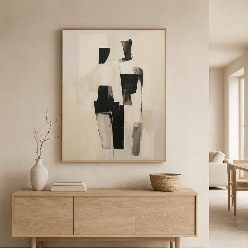Wabi sabi decorating objects​ above a wooden console table in a modern living room.