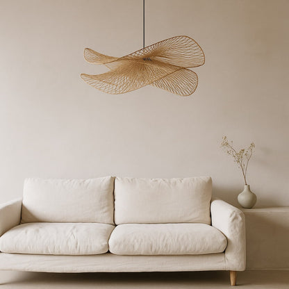 Beige sofa with a decorative wabi sabi lighting​ and vase in a minimalistic room.