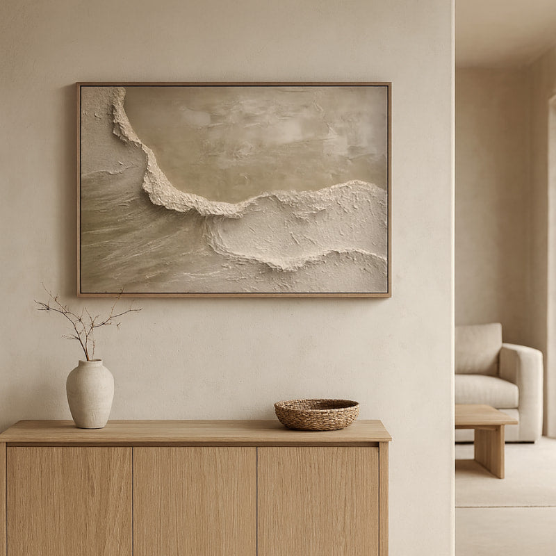 Wabi sabi mexican decor​ artwork on a wall above a wooden cabinet with decorative items.