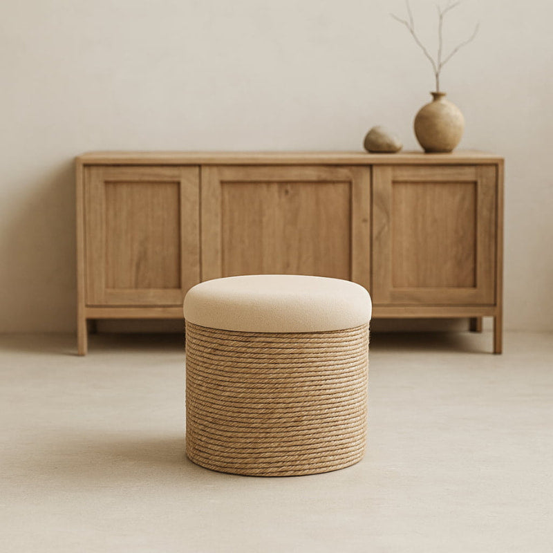 wabi sabi ottoman with beige cushion in front of wooden cabinet