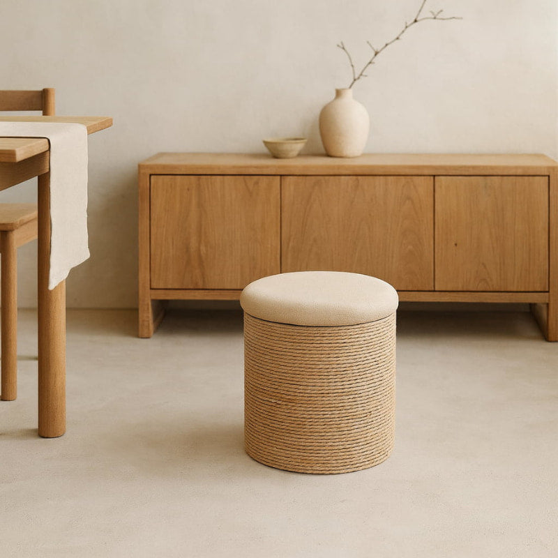 Wabi sabi storage ottoman with a cushion in a minimalistic room with wooden furniture.