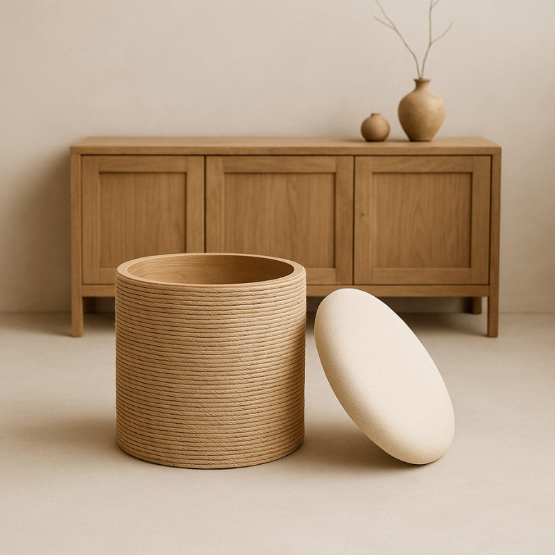 wabi sabi white storage ottoman with a wooden cabinet in the background.