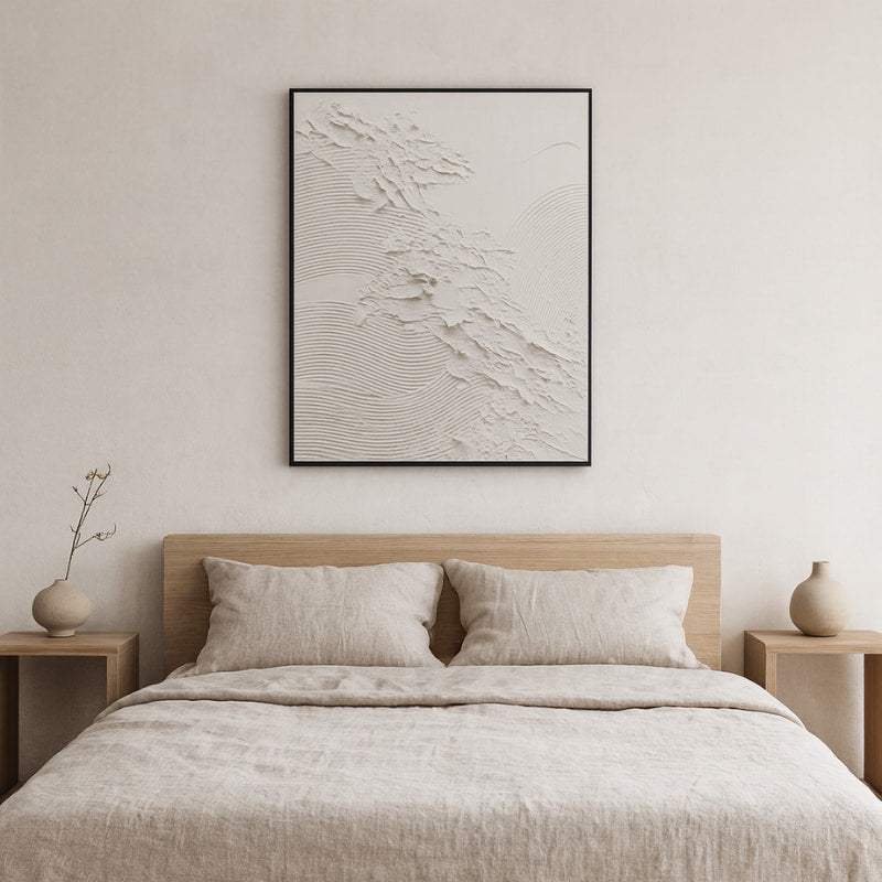 Beige bedroom with a bed, nightstands, and wall art zen​.