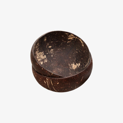 Two dark brown wood coconut bowls stacked on a white background
