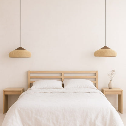 Minimalist bedroom with a bed, nightstands, and wood pendant light wabi sabi​