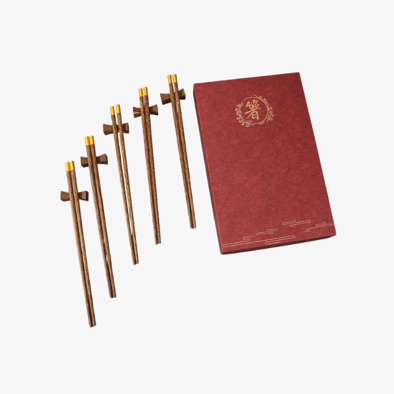 Set of wooden chopsticks with wooden chopsticks box​ on a white background