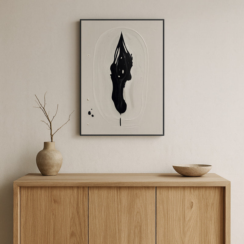 Zen wall art decor​ on a wall above a wooden cabinet with decorative items.