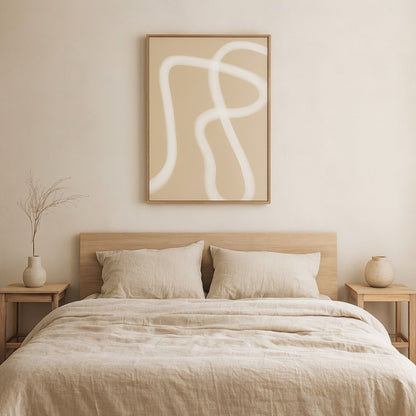 Beige bedroom with zen wall art prints​, bed, and side tables.